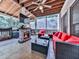 Cozy screened patio with stone fireplace and comfortable seating area at 4450 Barony Dr, Suwanee, GA 30024