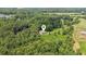 Aerial view of a private home with a pool nestled among lush green trees, offering a serene retreat at 5095 Karr Road Rd, Cumming, GA 30040