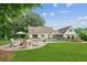Backyard featuring a pool, patio, fire pit, and well-manicured lawn at 5095 Karr Road Rd, Cumming, GA 30040