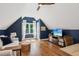 Bedroom with stylish blue walls, hardwood floors, and plenty of natural light at 5095 Karr Road Rd, Cumming, GA 30040