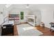 Upstairs bedroom with bunk beds, fun decor, and an air hockey table for entertainment at 5095 Karr Road Rd, Cumming, GA 30040