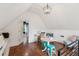 Bonus room with wood floors, natural light, and cozy decor at 5095 Karr Road Rd, Cumming, GA 30040