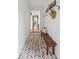 Hallway featuring herringbone brick floors, coat hooks and natural light at 5095 Karr Road Rd, Cumming, GA 30040