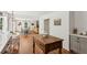 Spacious kitchen with hardwood floors, an island, and views to the dining and living areas at 5095 Karr Road Rd, Cumming, GA 30040