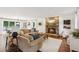 Spacious living room featuring a stone fireplace, hardwood floors, and ample natural light at 5095 Karr Road Rd, Cumming, GA 30040