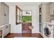 Mudroom with custom gray cabinetry, wood floors, and charming split door to the exterior at 5095 Karr Road Rd, Cumming, GA 30040