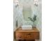 Stylish powder room featuring decorative wallpaper and a wood vanity at 5095 Karr Road Rd, Cumming, GA 30040