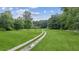 Gravel driveway and beautiful green field at 5095 Karr Road Rd, Cumming, GA 30040