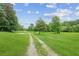 Gravel driveway and beautiful green field at 5095 Karr Road Rd, Cumming, GA 30040