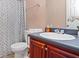 Bathroom with a toilet, vanity, neutral tones and a decorative shower curtain at 5865 El Segundo Way, Atlanta, GA 30349