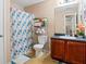Full bathroom featuring a shower-tub combo, vanity with storage, and neutral color scheme; functional and well-maintained at 5865 El Segundo Way, Atlanta, GA 30349