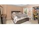 Comfortable bedroom with soft carpet, a large bed with built-in storage, and a walk-in closet; perfect for relaxation at 5865 El Segundo Way, Atlanta, GA 30349