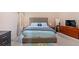 Serene bedroom with ample natural light, comfortable furnishings, and a closet for storage; a perfect sanctuary at 5865 El Segundo Way, Atlanta, GA 30349