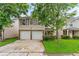 Charming two-story home with a two-car garage and a well-manicured lawn in a desirable neighborhood at 5865 El Segundo Way, Atlanta, GA 30349
