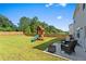 Large backyard featuring a playground and outdoor patio seating at 113 Poppy St, Mcdonough, GA 30253