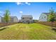 Expansive backyard with lush lawn, privacy fence, and room for outdoor activities at 113 Poppy St, Mcdonough, GA 30253
