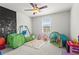 Playful bedroom featuring ' play area, bright artwork, and ample play space at 113 Poppy St, Mcdonough, GA 30253