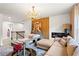 Bright bedroom featuring a stylish seating area, modern decor, and chandelier at 113 Poppy St, Mcdonough, GA 30253