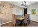 Dining room featuring a unique wood table and artistic wall design at 113 Poppy St, Mcdonough, GA 30253