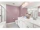 Bright bathroom with double vanity, marble-walled shower, and luxurious finishes at 113 Poppy St, Mcdonough, GA 30253