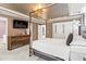 Well-appointed bedroom boasts hardwood floors, modern lighting, and a chic four-poster bed at 113 Poppy St, Mcdonough, GA 30253