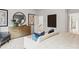 Relaxing bedroom showcasing a stylish dresser, couch, and an open doorway, creating an inviting and comfortable space at 817 Dobby Way, Mcdonough, GA 30252