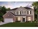 Charming two-story home featuring a brick and siding exterior, well-manicured lawn, and an attached two-car garage at 817 Dobby Way, Mcdonough, GA 30252