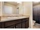 Bright bathroom with double sinks, and patterned shower curtain for privacy at 8484 Glenview St, Douglasville, GA 30134