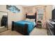 Comfortable bedroom featuring a dark wood bed frame, plush carpet, and natural light at 8484 Glenview St, Douglasville, GA 30134