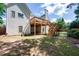 Spacious backyard featuring a two-story deck and lush greenery, perfect for outdoor entertaining at 205 Finsbury Park Ct, Suwanee, GA 30024