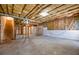 Unfinished basement showcasing the framing and utility components, ready for a custom remodel at 205 Finsbury Park Ct, Suwanee, GA 30024