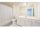 Bathroom featuring vanity with generous counter space, white cabinets, and a shower-tub combination at 205 Finsbury Park Ct, Suwanee, GA 30024