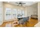 Eat-in dining area with natural light, modern furniture, and easy access to both kitchen and living room at 205 Finsbury Park Ct, Suwanee, GA 30024