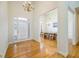 Bright foyer with hardwood floors, high ceilings, and views into the dining room at 205 Finsbury Park Ct, Suwanee, GA 30024