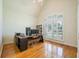 Bright office space with a large window and a stylish wooden desk at 205 Finsbury Park Ct, Suwanee, GA 30024