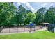 Fenced community playground with colorful play structures and picnic area, ideal for Gathering fun at 205 Finsbury Park Ct, Suwanee, GA 30024