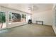 Enclosed sunroom with views of the deck and backyard with a grill for outdoor cooking at 205 Finsbury Park Ct, Suwanee, GA 30024
