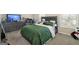 Bedroom featuring dark grey furniture, a large bed, and natural light from the window at 2277 Church St, Hampton, GA 30228