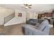 Cozy open living area with comfortable seating, wood flooring, and a staircase, creating a welcoming atmosphere at 2277 Church St, Hampton, GA 30228