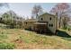 Back of house with deck and large backyard at 494 Rue Montaigne, Stone Mountain, GA 30083