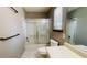 Neutral bathroom with tiled floors, shower-tub combination, and vanity with sink at 494 Rue Montaigne, Stone Mountain, GA 30083
