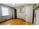 Bedroom features hardwood floors, a window, a built-in closet, and closet shelving at 494 Rue Montaigne, Stone Mountain, GA 30083