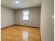 Bright bedroom features hardwood floors and a window at 494 Rue Montaigne, Stone Mountain, GA 30083