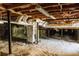 Spacious crawl space featuring vapor barrier, HVAC duct work, and visible support beams, offering ample under-house access at 494 Rue Montaigne, Stone Mountain, GA 30083