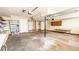 Large two-car garage with painted walls, storage shelves, and a utility sink, offering space and functional storage at 494 Rue Montaigne, Stone Mountain, GA 30083