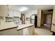 Bright kitchen with white cabinets, tiled floors, and new stainless steel refrigerator at 494 Rue Montaigne, Stone Mountain, GA 30083