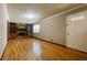 Living room featuring a stone fireplace, built-in shelving and hardwood floors at 494 Rue Montaigne, Stone Mountain, GA 30083