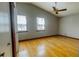 Spacious bedroom featuring hardwood floors, vaulted ceiling, and ceiling fan at 494 Rue Montaigne, Stone Mountain, GA 30083