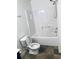 Bathroom featuring a standard white toilet, tub with shower, and a hand towel rack at 1188 To Lani Path, Stone Mountain, GA 30083