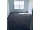 A bedroom featuring gray carpeting, a window with closed white blinds and white walls at 1188 To Lani Path, Stone Mountain, GA 30083